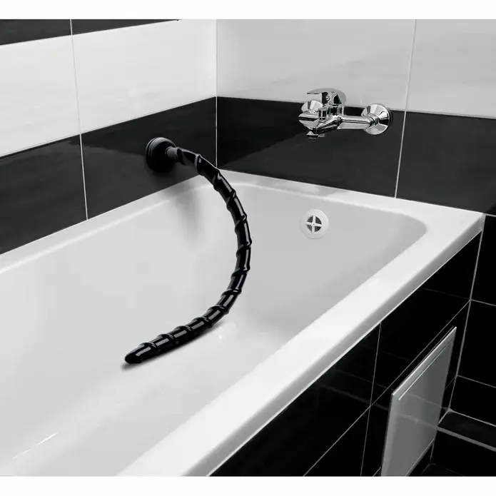 Black flexible faucet hose over bathtub.