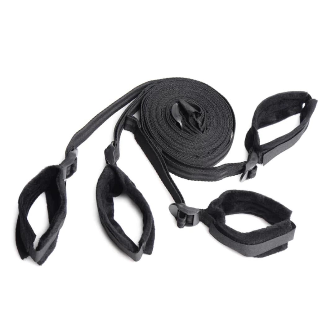Black adjustable bed restraints for secure positioning.