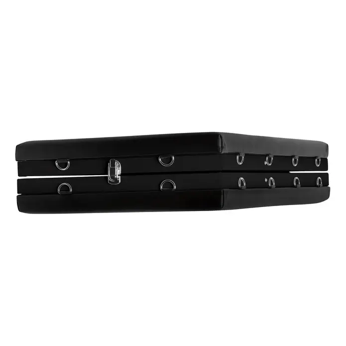 Black leather bondage platform with metal rings.