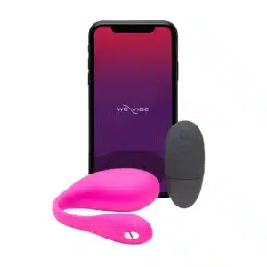 Smartphone, pink massager, and remote control displayed