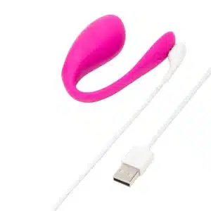 Pink wireless vibrator with USB charging cable.