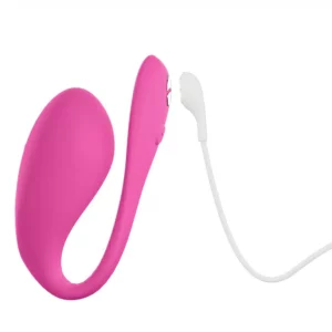 Pink wearable vibrator with magnetic charger cable.