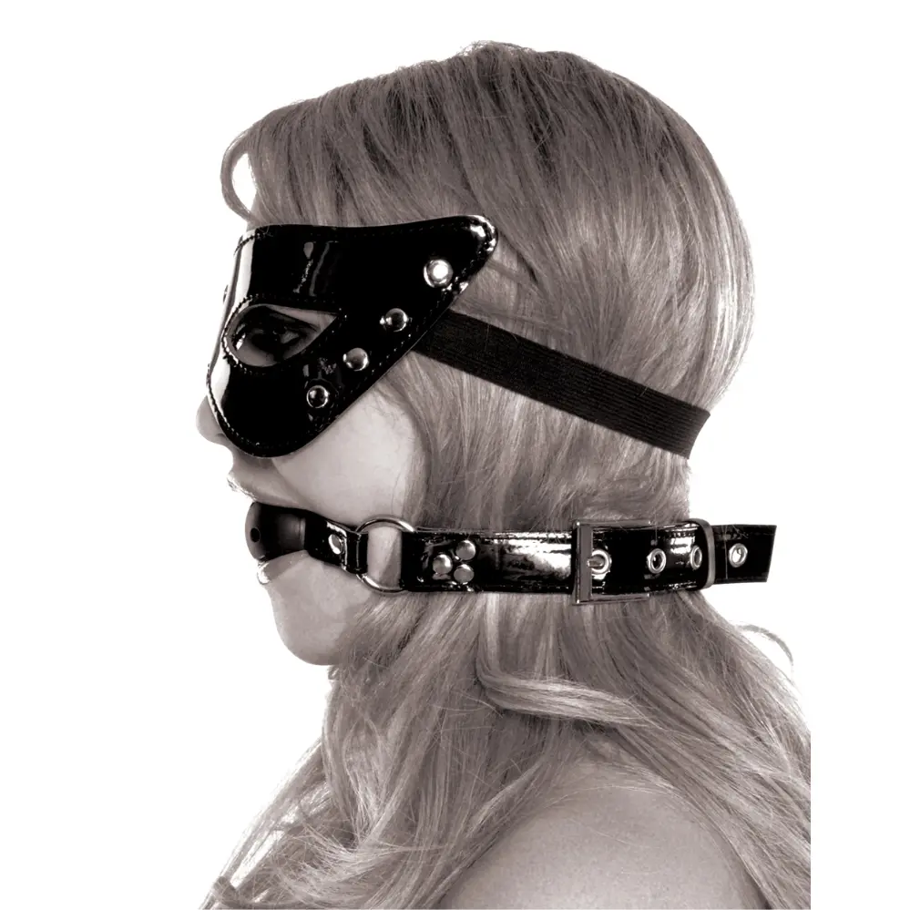 Person in mask and ball gag side view