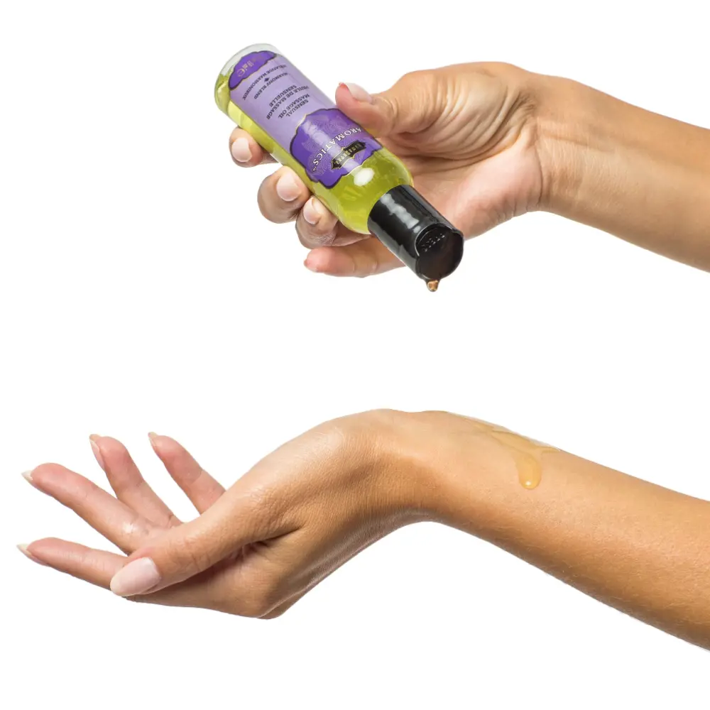 Applying lavender oil to hand for skincare.