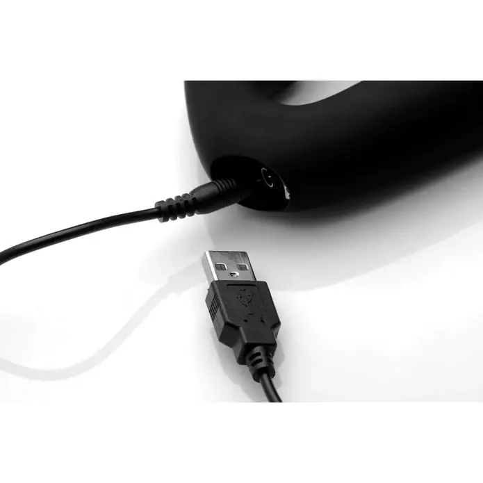 USB cable connected to black electronic device.