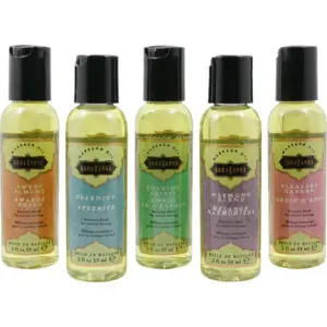 Five aromatherapy massage oil bottles in a row.